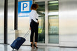 © Cavan Images - stewardess with her suitcase using the elevator