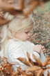 © triocean - Outdoor portrait of 3 years old adorable blonde girl in the autumn forest.
