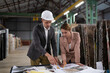 © Cavan Images - Elegant colleagues working in warehouse