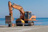 Fototapeta Uliczki - Malaga, Spain - November 01, 2020.Construction machine on the beach.