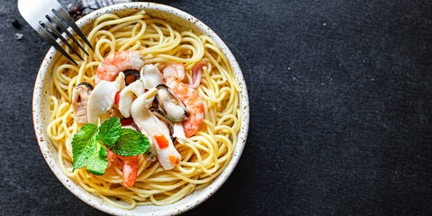 pasta spaghetti seafood shrimp, mussels, squid and more second course healthy meal snack top view copy space for text food background rustic