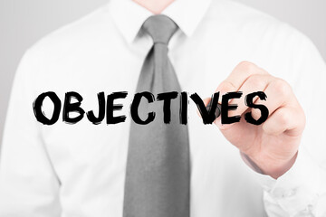 Poster - businessman writing word objectives with marker, business concept