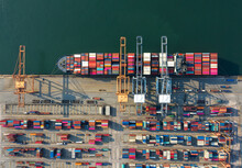 Container , Container Ship In Export And Import Business And Logistics. Shipping Cargo To Harbor By Crane. Water Transport International. Aerial View And Top View.