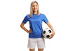 © Ljupco Smokovski - Female soccer player smiling and posing with a soccer ball under her arm