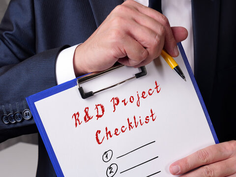 Business concept about Research Development R&D Project Checklist with sign on the sheet.