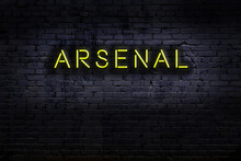 Night View Of Neon Sign On Brick Wall With Inscription Arsenal