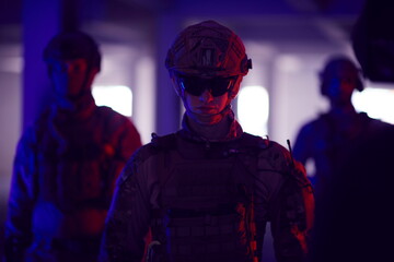 soldier squad team portrait in urban environment colored lightis