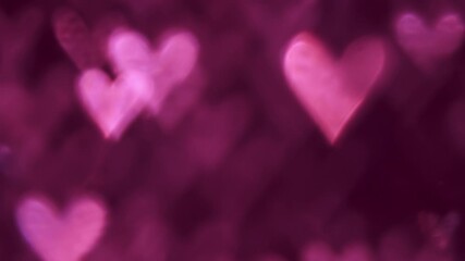 Poster - Glowing heart shaped lights sparkling on soft pink background. Romantic Valentine's day background.