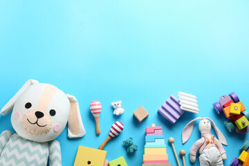 Wall Mural - Flat lay composition with different toys on light blue background. Space for text