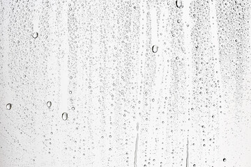 Wall Mural - white isolated background water drops on the glass / wet window glass with splashes and drops of water and lime, texture autumn background