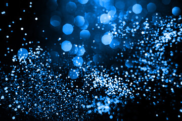 Wall Mural - abstract bokeh on dark blue background. holiday concept