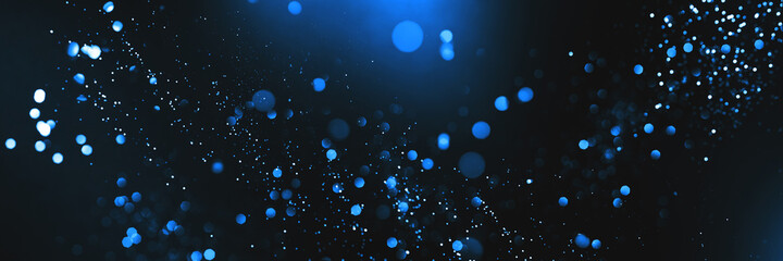 Wall Mural - abstract bokeh on dark blue background. holiday concept