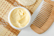© kazmulka - Yellow facial mask (banana face cream, shea butter hair mask, body butter) in the small white container. Natural skin and hair concept. Top view, copy space.