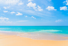 Beautiful Tropical Beach Sea Ocean With White Cloud And Blue Sky