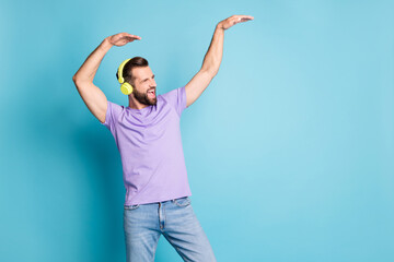 Sticker - Photo of young excited crazy man have fun enjoy radio music dance look empty space isolated over blue color background