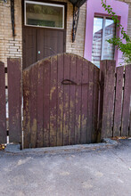 Small Old Wooden Gates Near Residential Homes.
