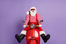 Photo Of Careless Santa Claus Ride Scooter Have Fun Wear X-mas Costume Striped Shirt Headwear Glasses Isolated Violet Color Background