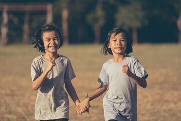 Wall Mural - Kids running and playing on field