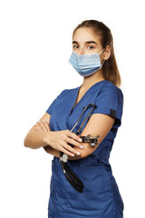 Young beautiful woman doctor in blue surgical gown with stethoscope isolated on white background. Copspace