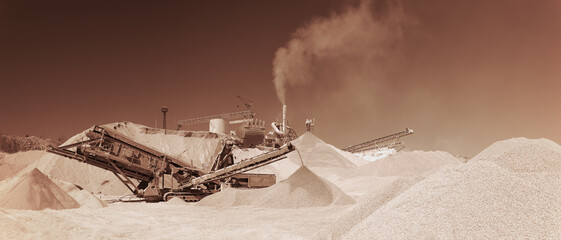 Wall Mural - Stone crushing equipment at the limestone quarry, monochrome panoramic image of a light brown color, sepia. Mining industry.