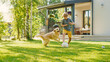 © Gorodenkoff - Handsome Young Boy Plays Soccer with Happy Golden Retriever Dog at the Backyard Lawn. He Plays Football and Has Lots of Fun with His Loyal Doggy Friend. Idyllic Summer House.