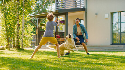 Wall Mural - Handsome Father and Son Play Catch With Loyal Family Friend Golden Retriever Dog. Family Spending Time Together Training Dog. Sunny Day Idyllic Suburban Home Backyard.