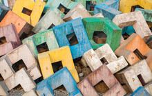 Abstract Background Of Concrete Blocks Painted In Pastel Colors