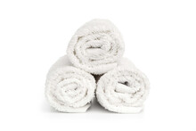 Stack Of White Clean Towels Rolled Up On White Background