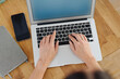 © contrastwerkstatt - Hands of a businesswoman using a laptop