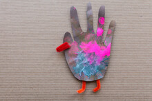 Thanksgiving Craft Project Child's Art: Hand Cutout Turkey With Bright Colors And Pipe Cleaners