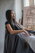 Beautiful Asian Woman Posing In The Art Studio