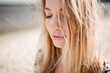 © Chris Zielecki/Stocksy - Calm woman standing at seaside