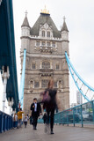 Fototapeta Londyn - People and cars moving fast over the Tower Bridge