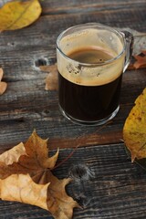 Espresso coffee and autumn leaves on the table 