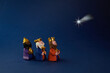 Leinwandbild Motiv Happy Epiiphany day. Three wise man ant star on blue background.