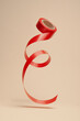 © Andoni Beristain/Stocksy - Red ribbon for gift
