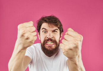 Canvas Print - Man on a pink background surprise irritability emotions and stress