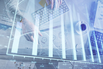 Poster - Multi exposure of man's hands typing over computer keyboard and forex graph hologram drawing. Top view. Financial markets concept.