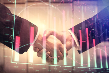 Double exposure of forex graph hologram and handshake of two men. Stock market concept.