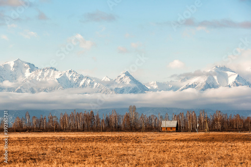Cuadros en Lienzo landscape with mountains and clouds, lonely village house against the backdrop