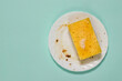 © kvladimirv - Dirty white plate and sponge with cleaning gel on a blue background.