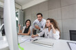 © nikomsolftwaer - Call center worker accompanied by her team. Asian woman working in call center office as a telemarketer, customer support operator at work