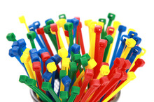 Isolated Shot Of A Bunch Of Multicolored Cable Ties On White Background