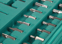 Closeup Shot Of Various Size Of Drive Screwdriver Tips On A Green Case
