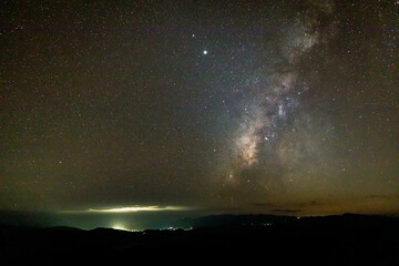 Wall Mural - night landscape with colorful milky way