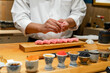 Japanese Sushi Chef making Blue Fin Otoro Sushi. Omakase sushi course.