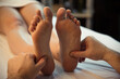 © Eno1 - Male hands of a massage therapist does a woman foot massage
