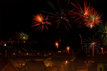 Canvas Print - Fireworks show over a city at new years eve