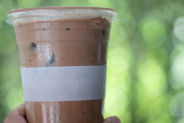 A plastic cup of iced mocha coffee