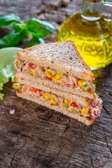 Wall Mural - Healthy tuna sandwich with tomato, corn and onion 